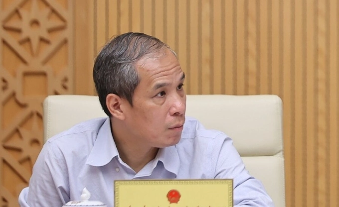 Phó thống đốc Ngân hàng Nhà nước Đoàn Thái Sơn báo cáo tại cuộc họp Chính phủ, ngày 6/9. Ảnh: VGP